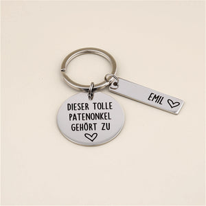 Personalisierter Schlüsselanhänger „Dieser tolle Patenonkel gehört zu“ mit Namensanhänger Emil.